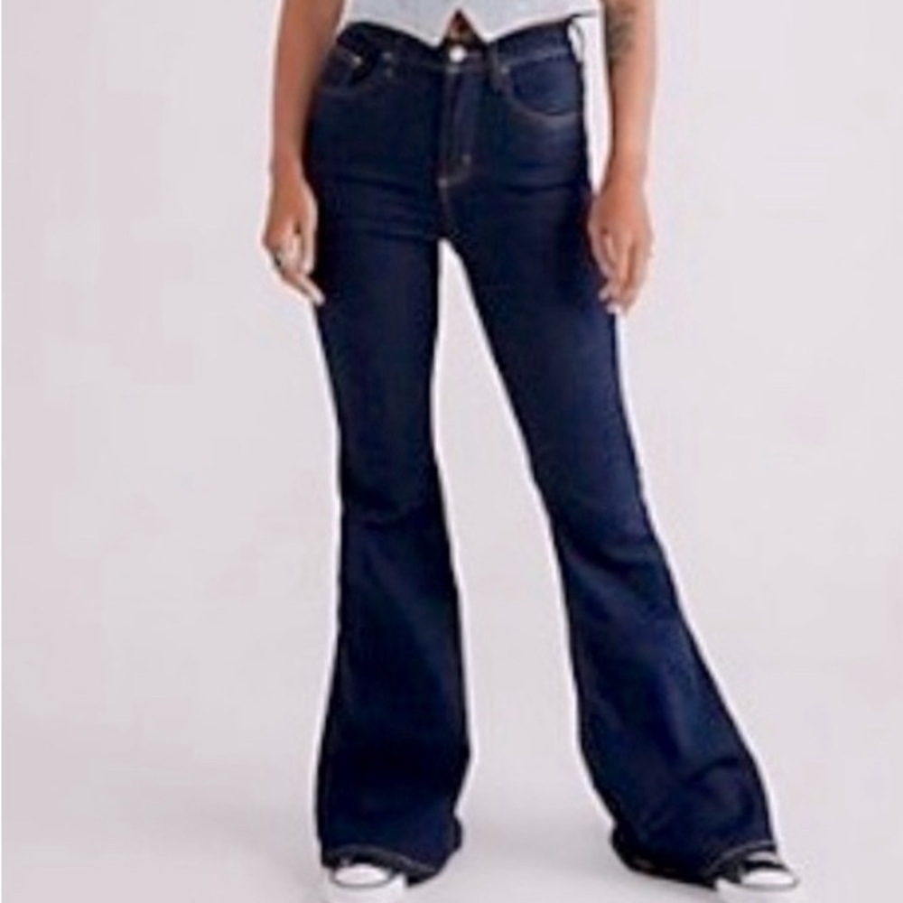 Free People High Rise pull on flare zipper jeans.